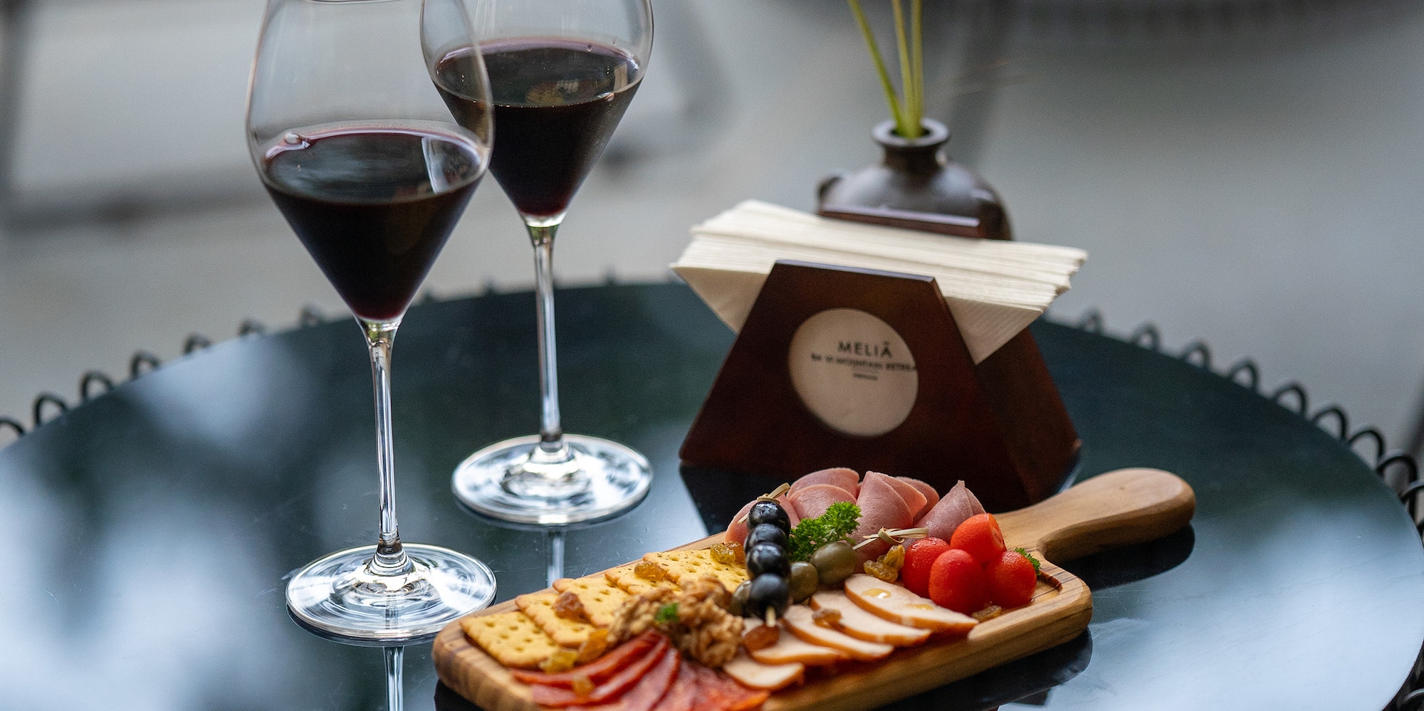 a table with wine glasses and food on it