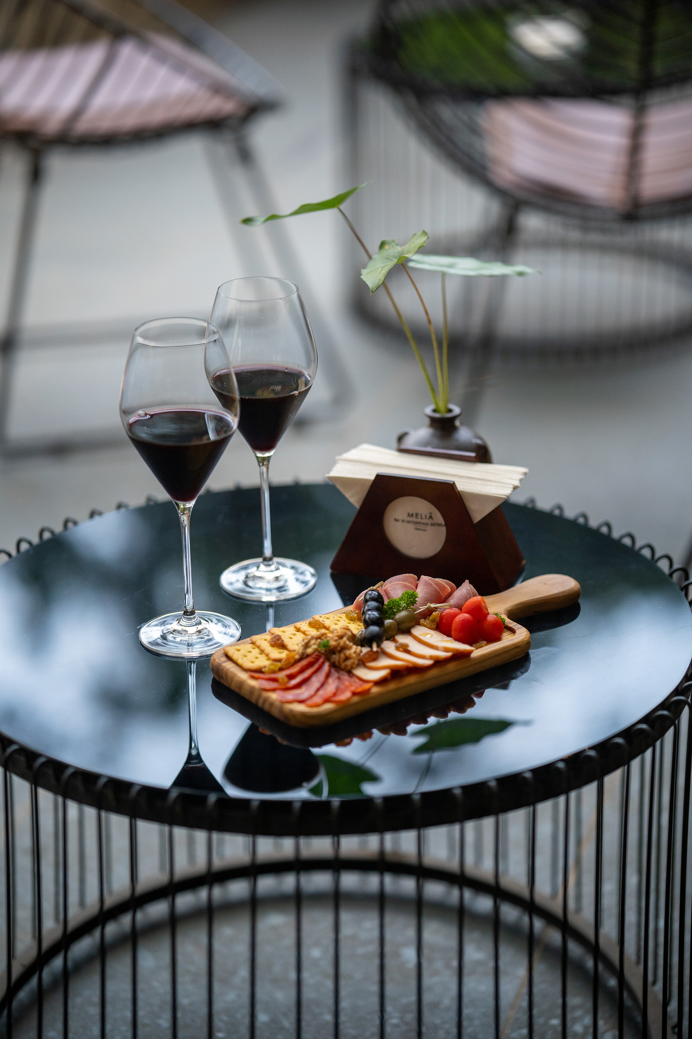 a table with wine glasses and food on it