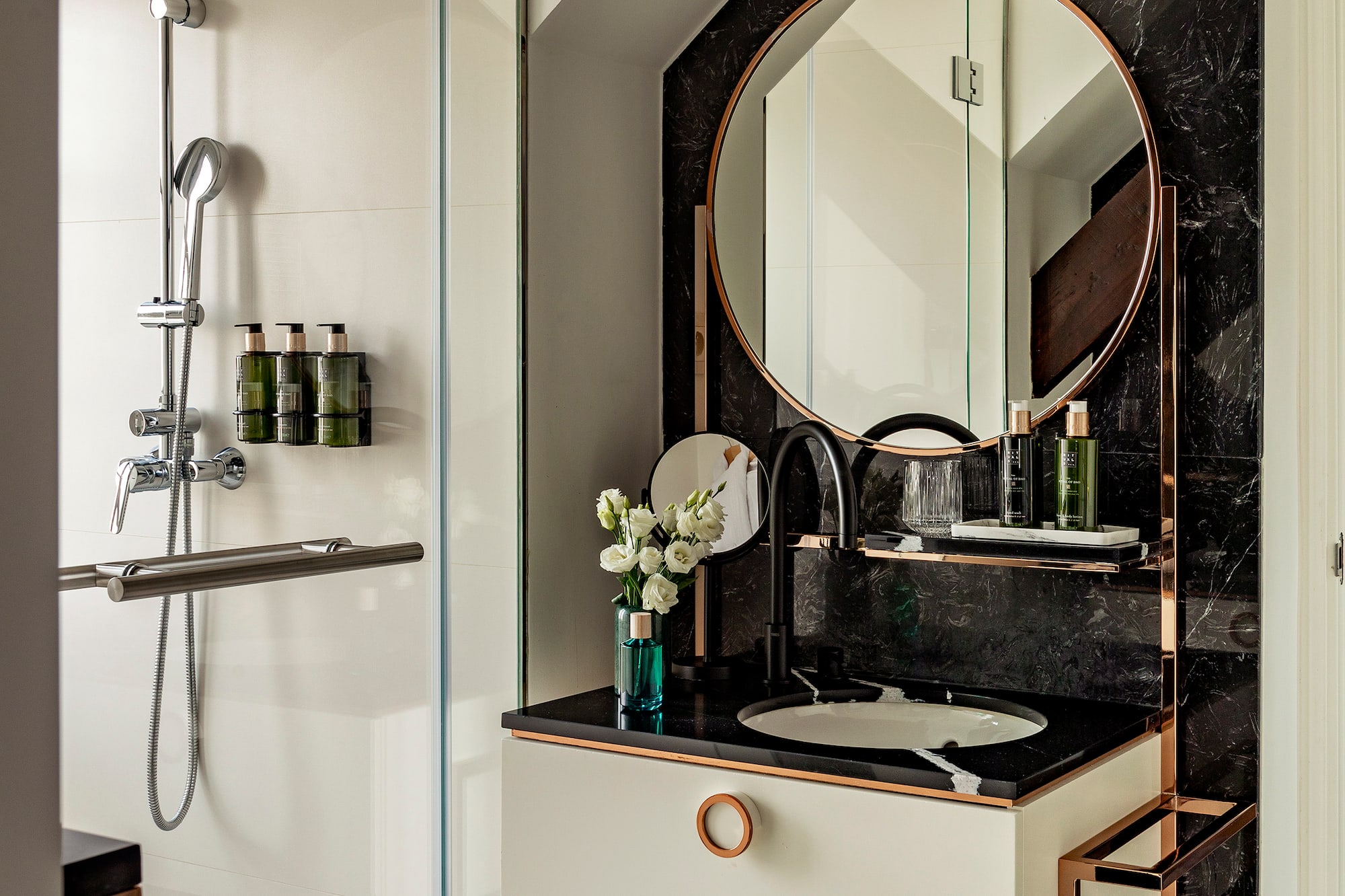 a bathroom with a mirror and a sink