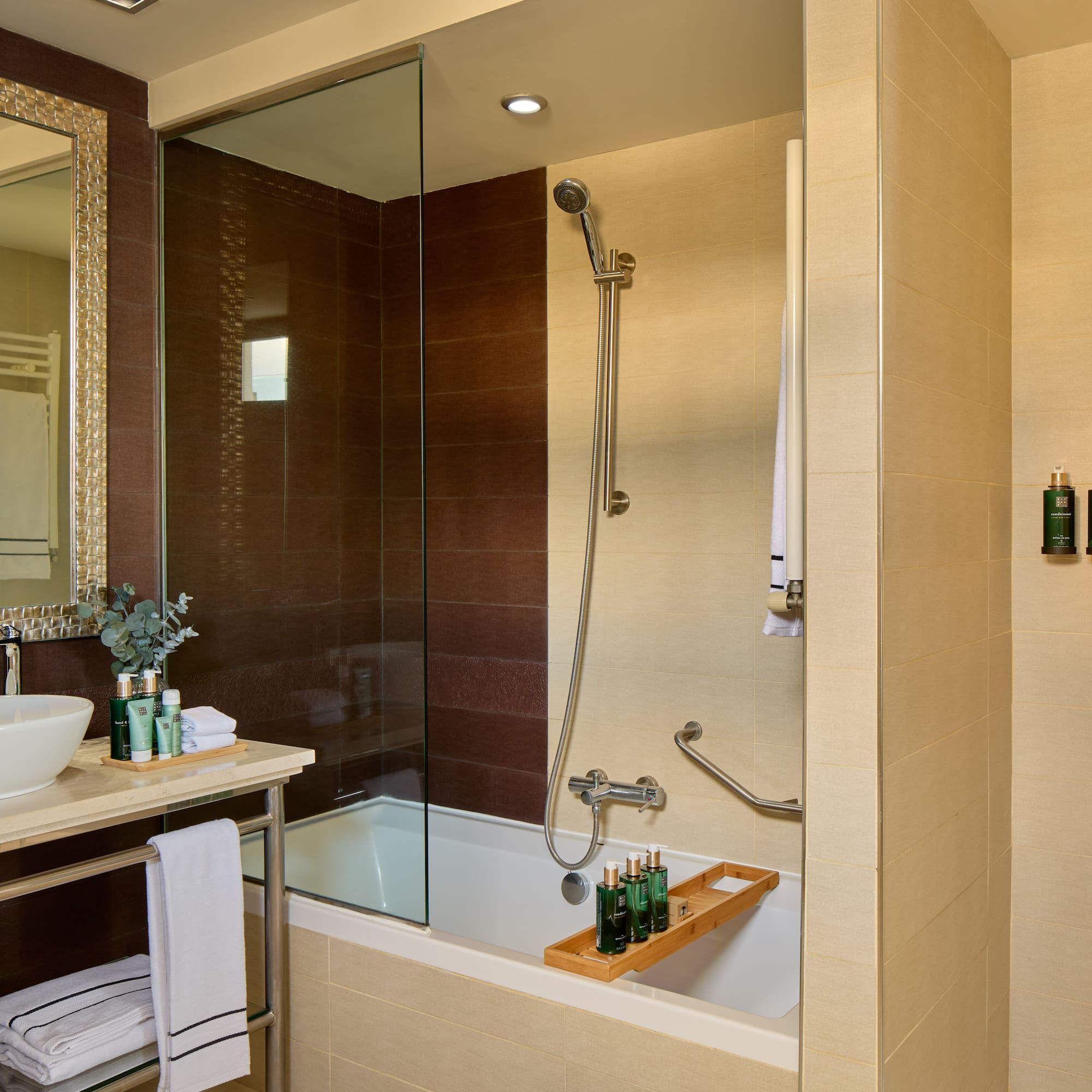 a bathroom with a glass shower door
