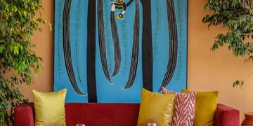 a room with a painting on the wall