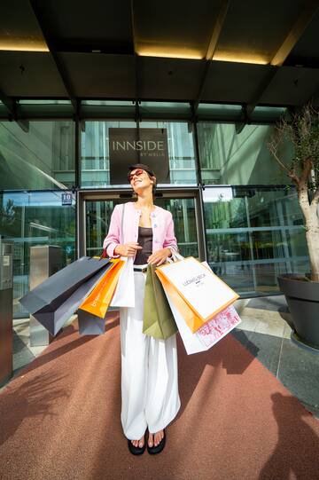 a woman holding shopping bags