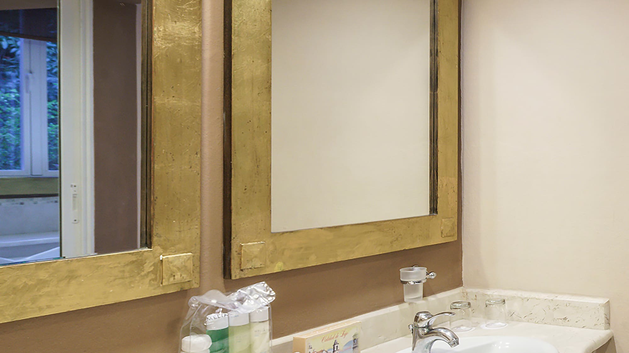 a bathroom with two sinks and mirrors
