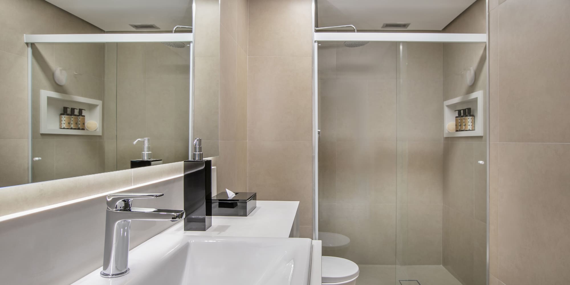 a bathroom with a shower and sink