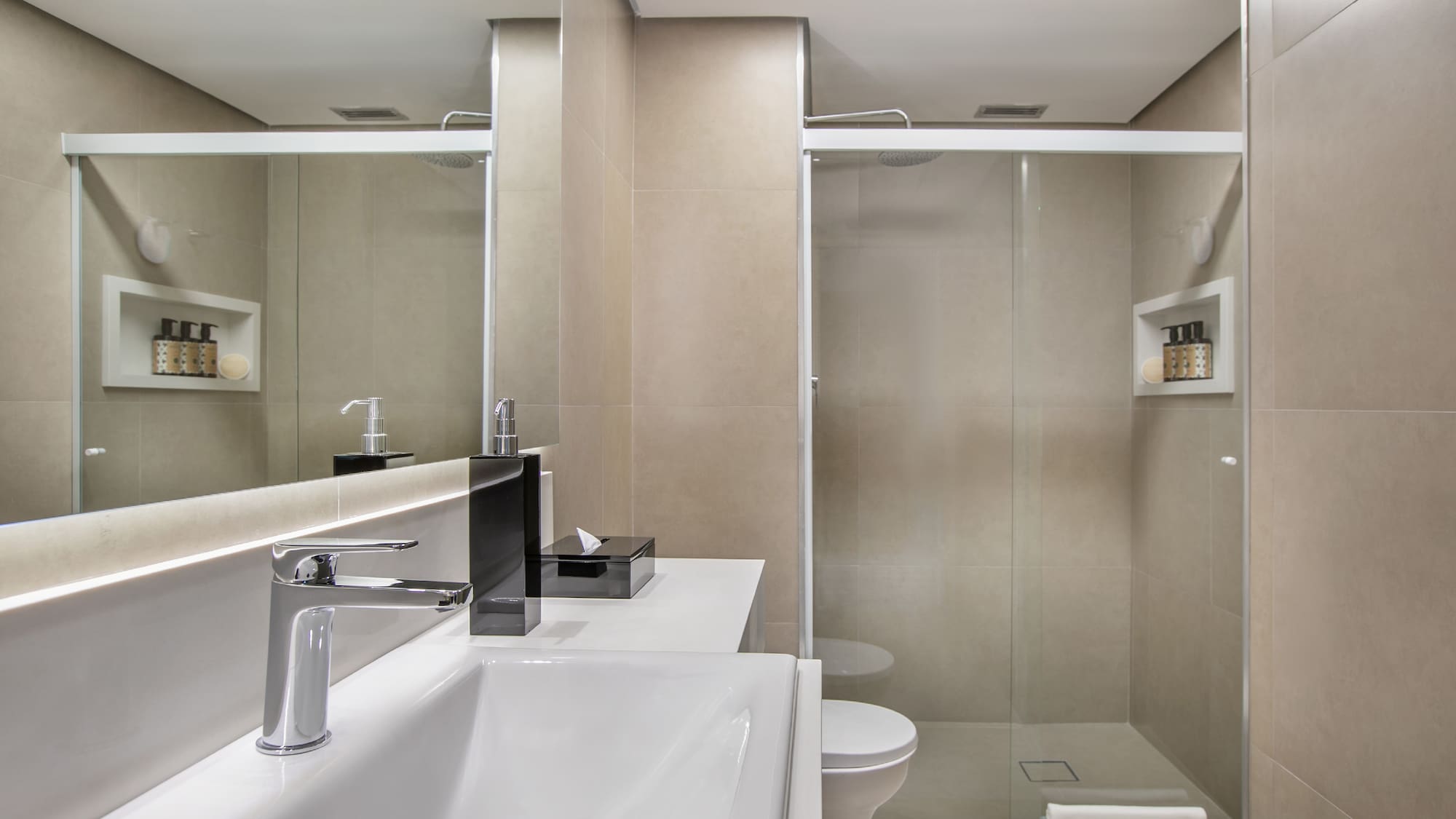 a bathroom with a shower and sink