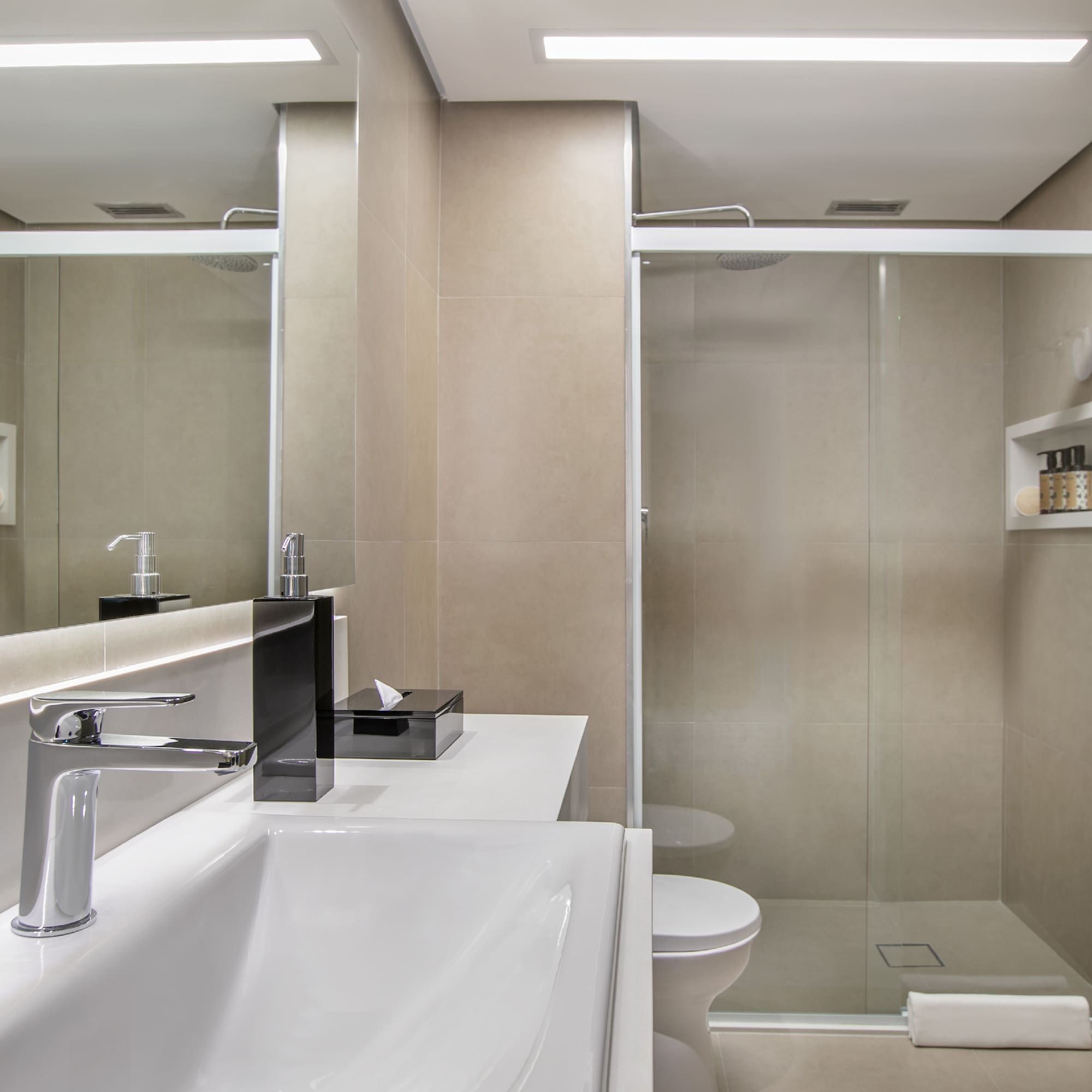 a bathroom with a shower and sink