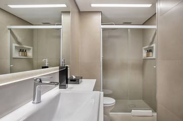 a bathroom with a shower and sink