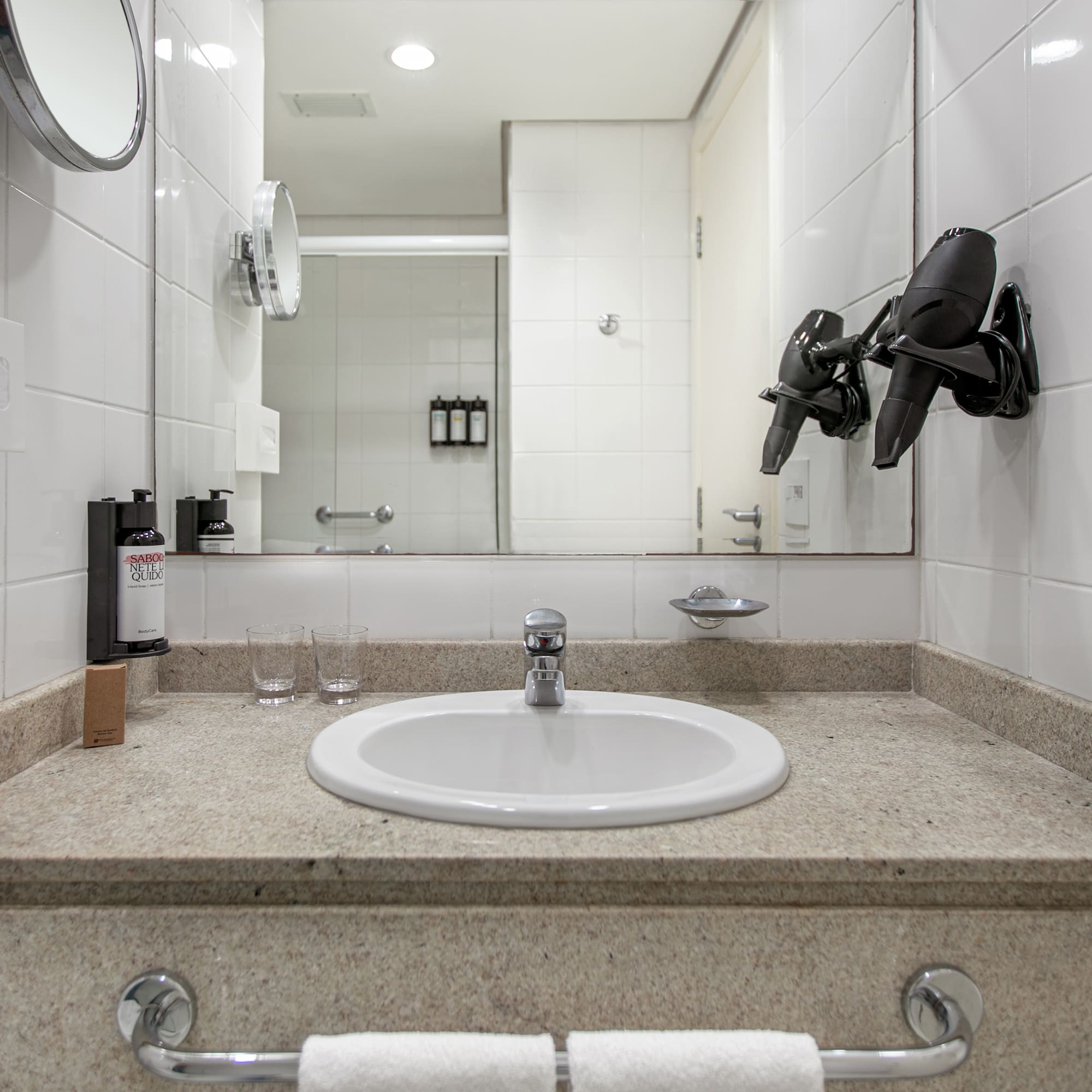 a bathroom sink with a mirror and a mirror