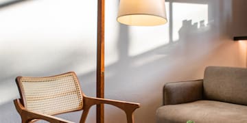 a chair and a lamp in a room