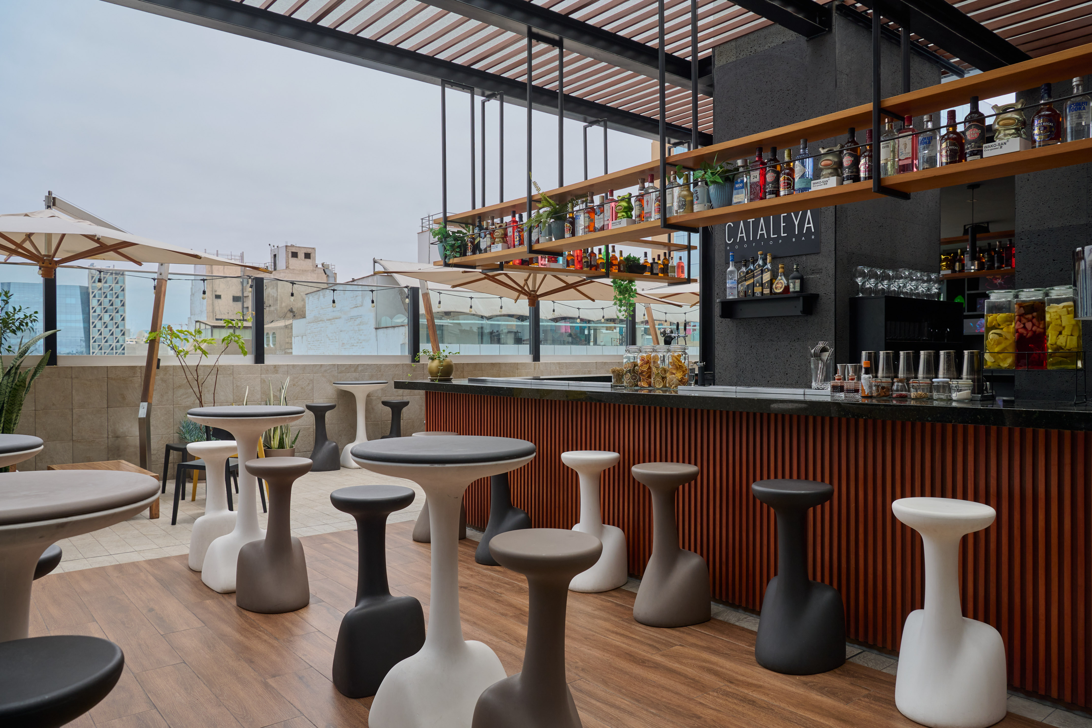 CATALEYA ROOFTOP BAR: Modern outdoor lounge with stylish seating and city view.