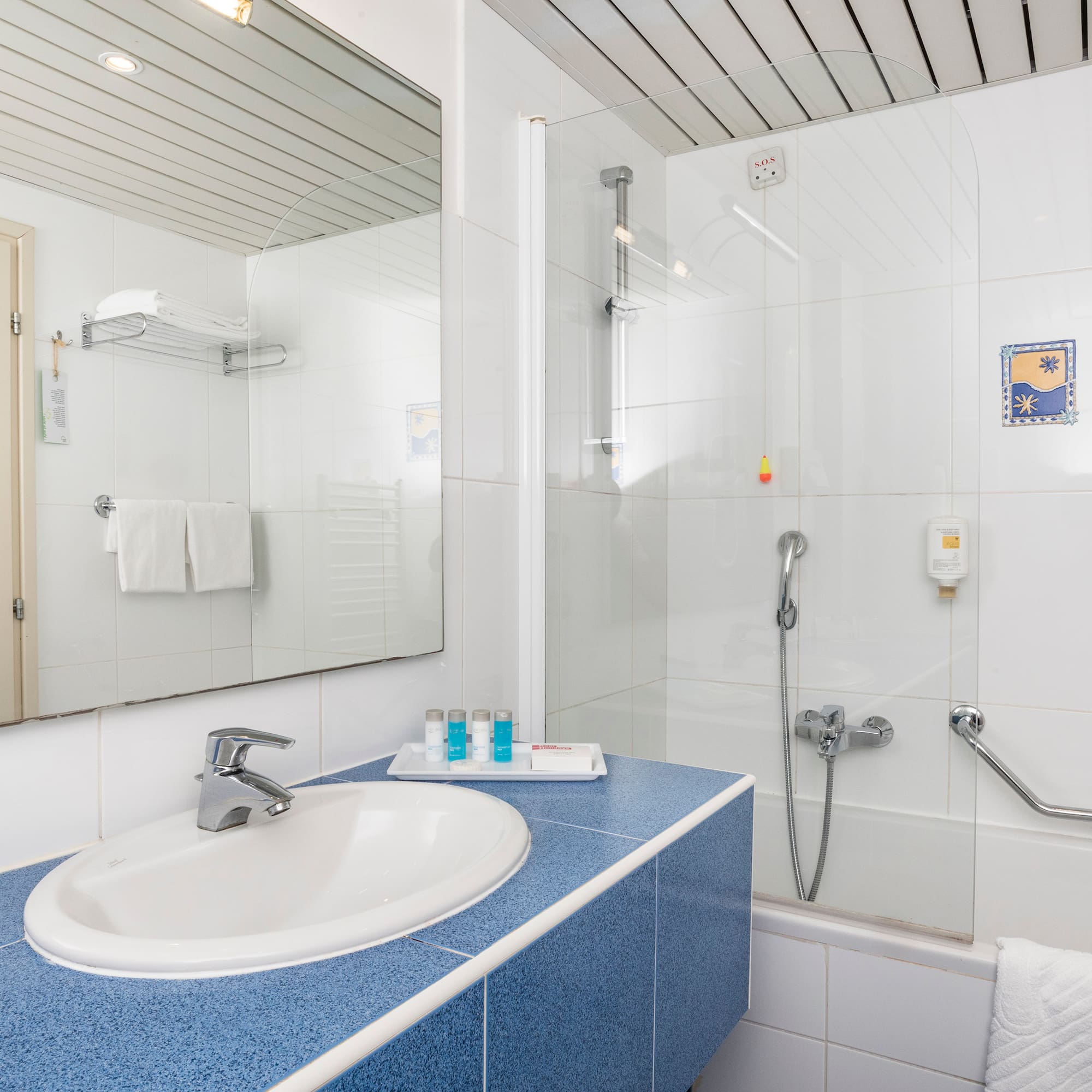 a bathroom with a shower and sink