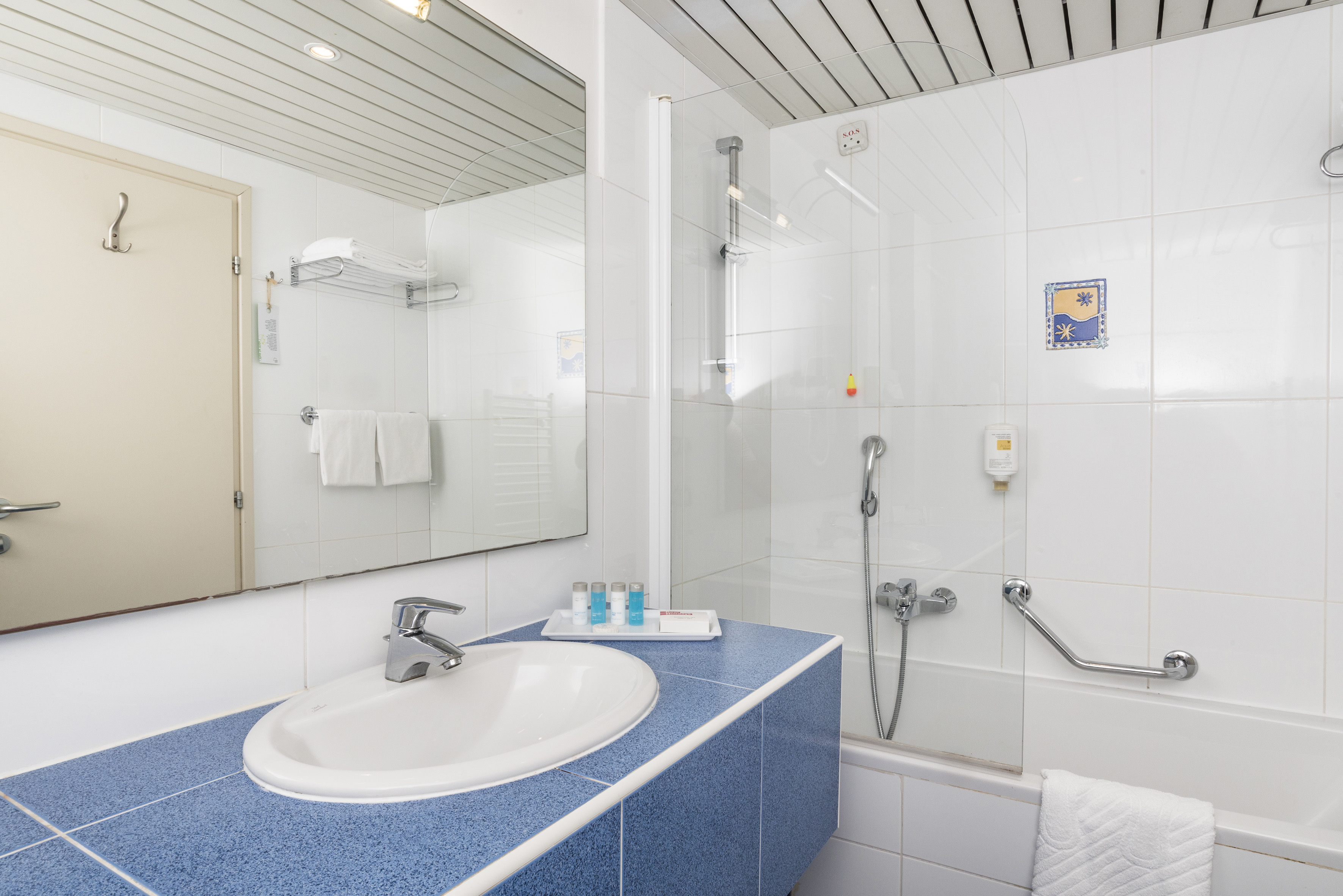 a bathroom with a shower and sink