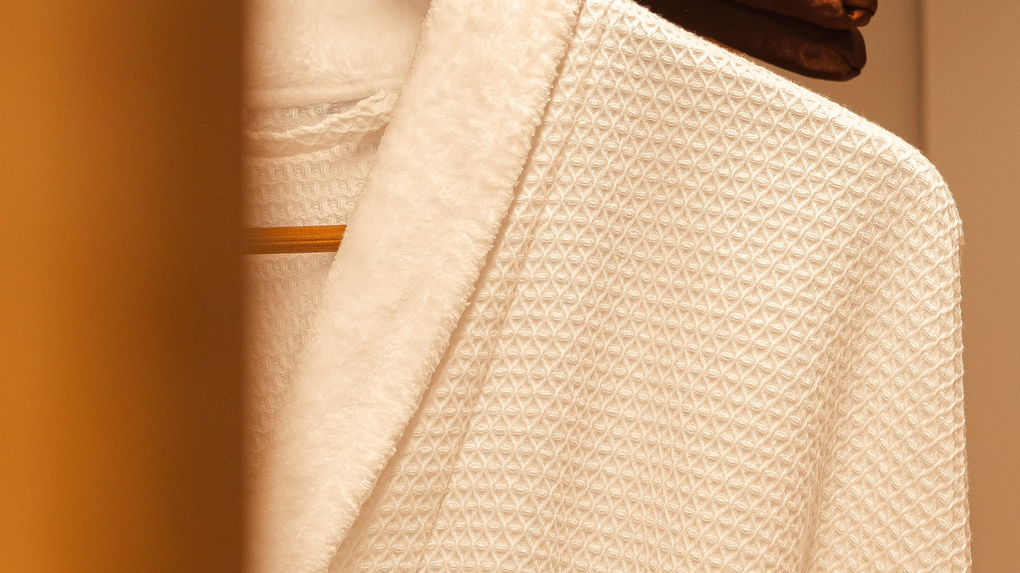 a white robe on a swinger