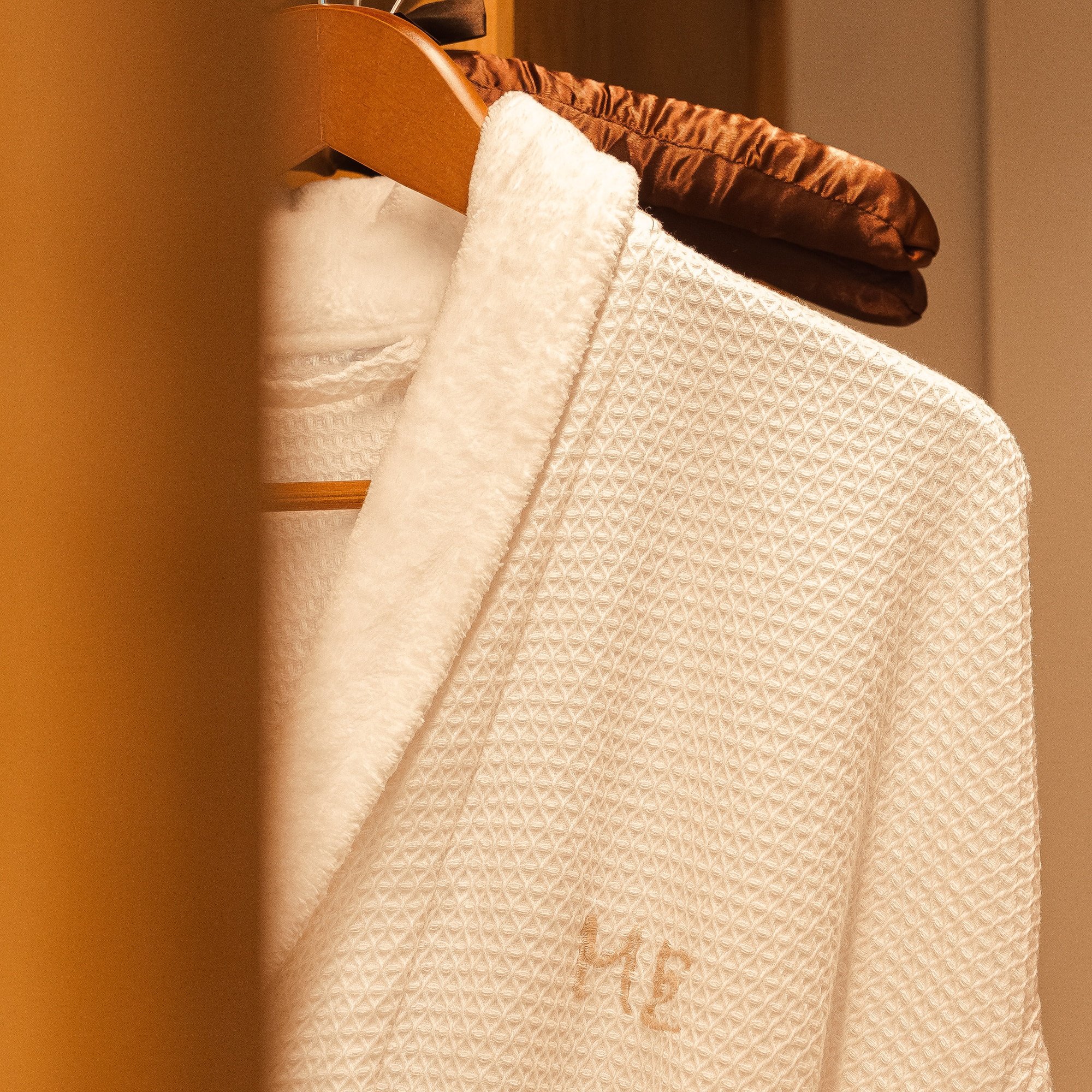 a white robe on a swinger