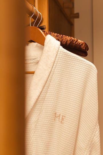 a white robe on a swinger