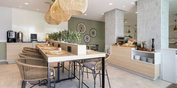 a restaurant with a long table and chairs