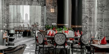 a room with a table and chairs