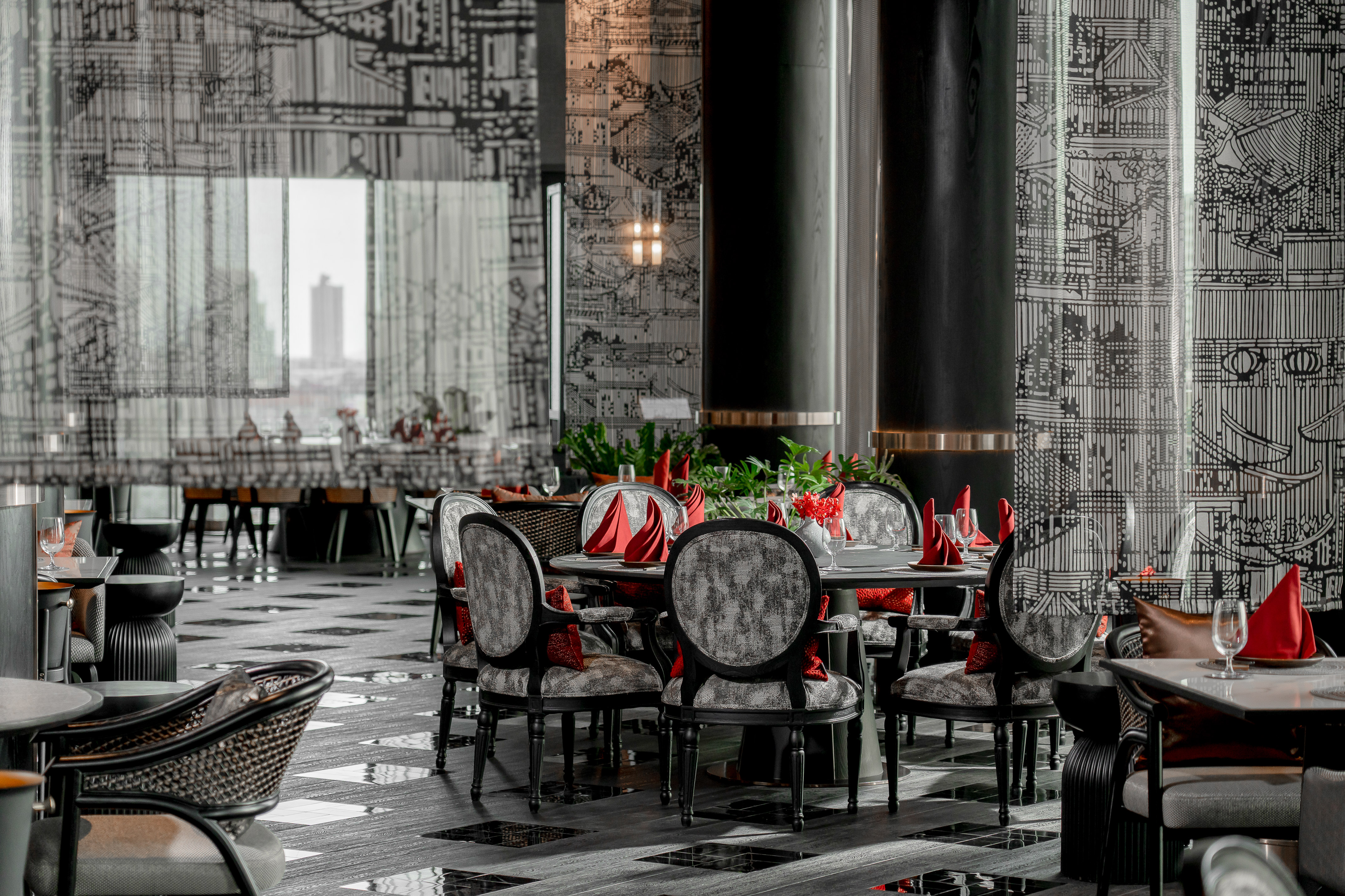 Modern restaurant interior with black and white decor, set tables, and city views. - Nhà hàng Trung Quốc Yítong & Sky Bar, Ẩm thực Trung Hoa - Meliá Pattaya Hotel, Pattaya
