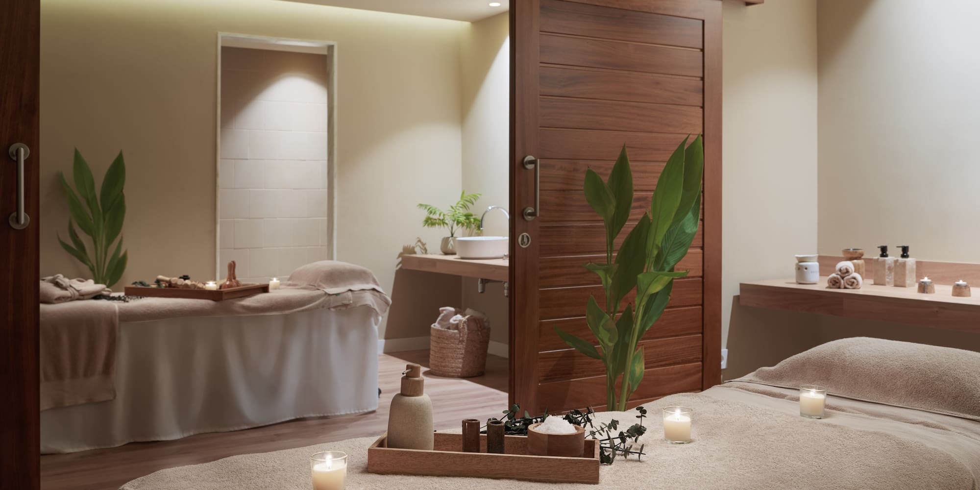 a massage table with candles in a room