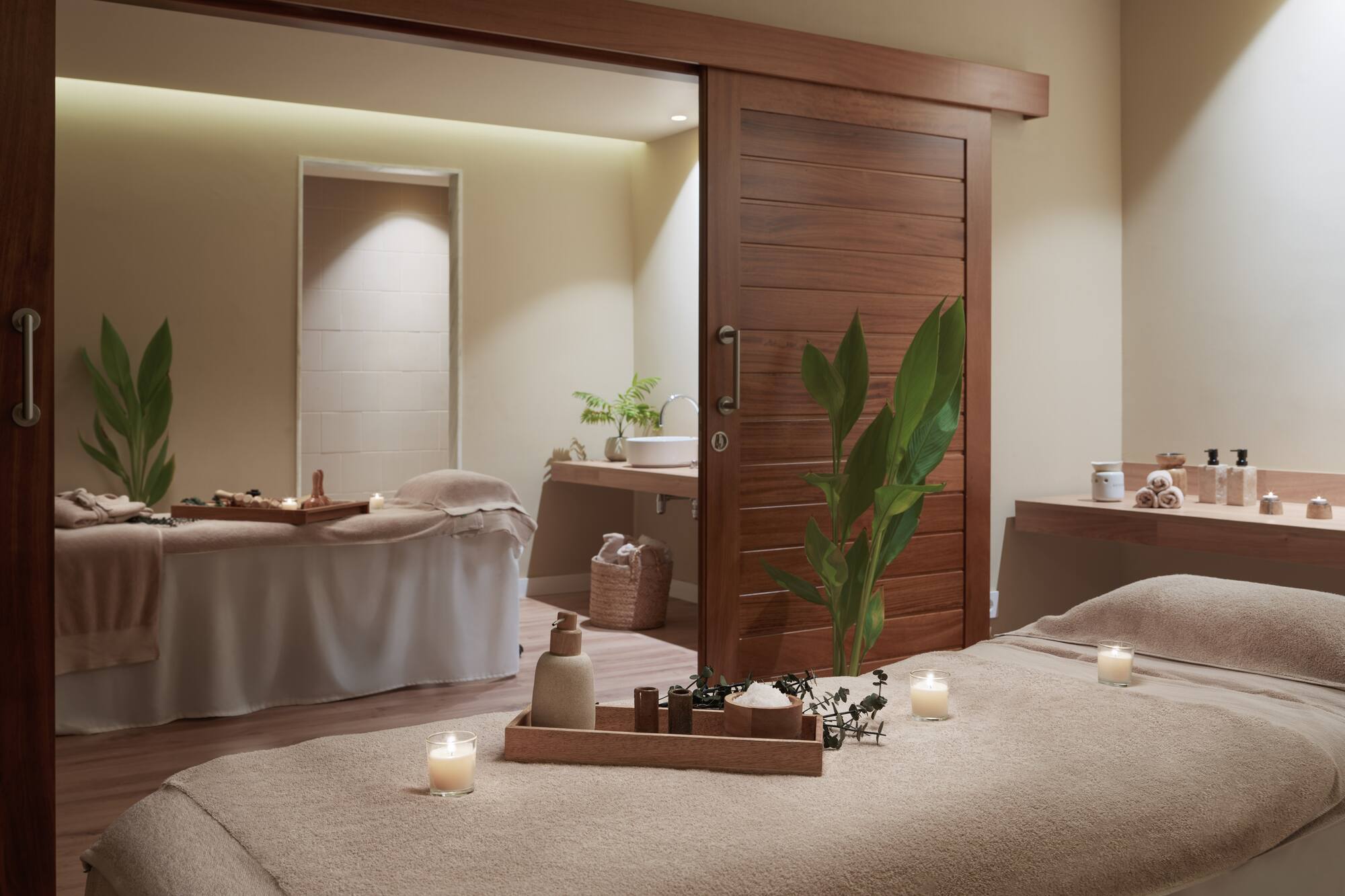 a massage table with candles in a room