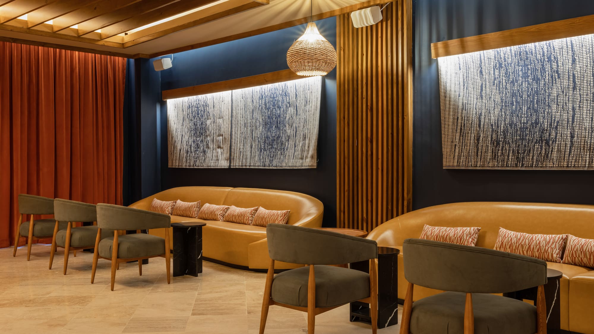 a room with a couch and chairs