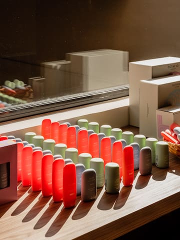 a group of colorful objects on a window sill