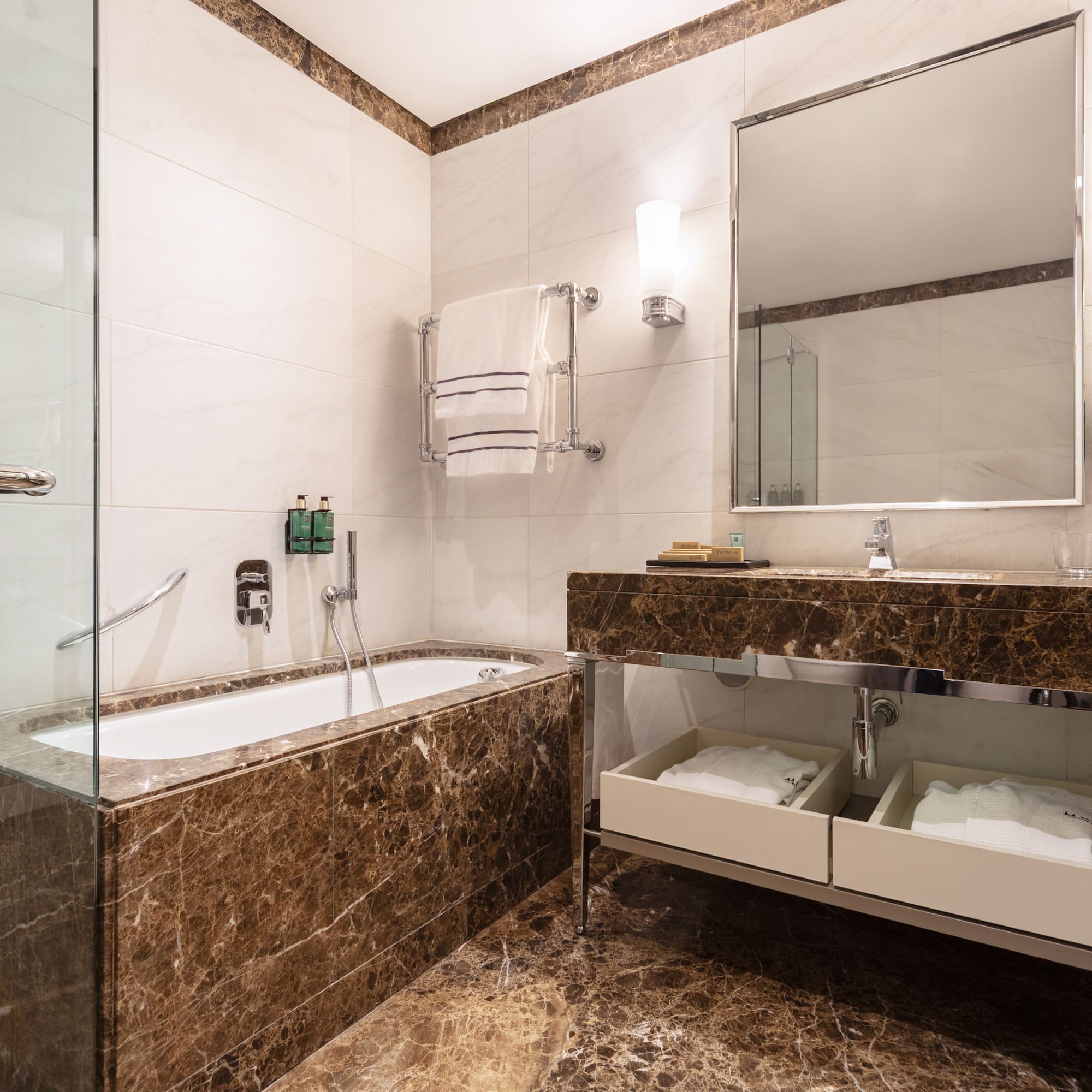 a bathroom with a bathtub and a mirror