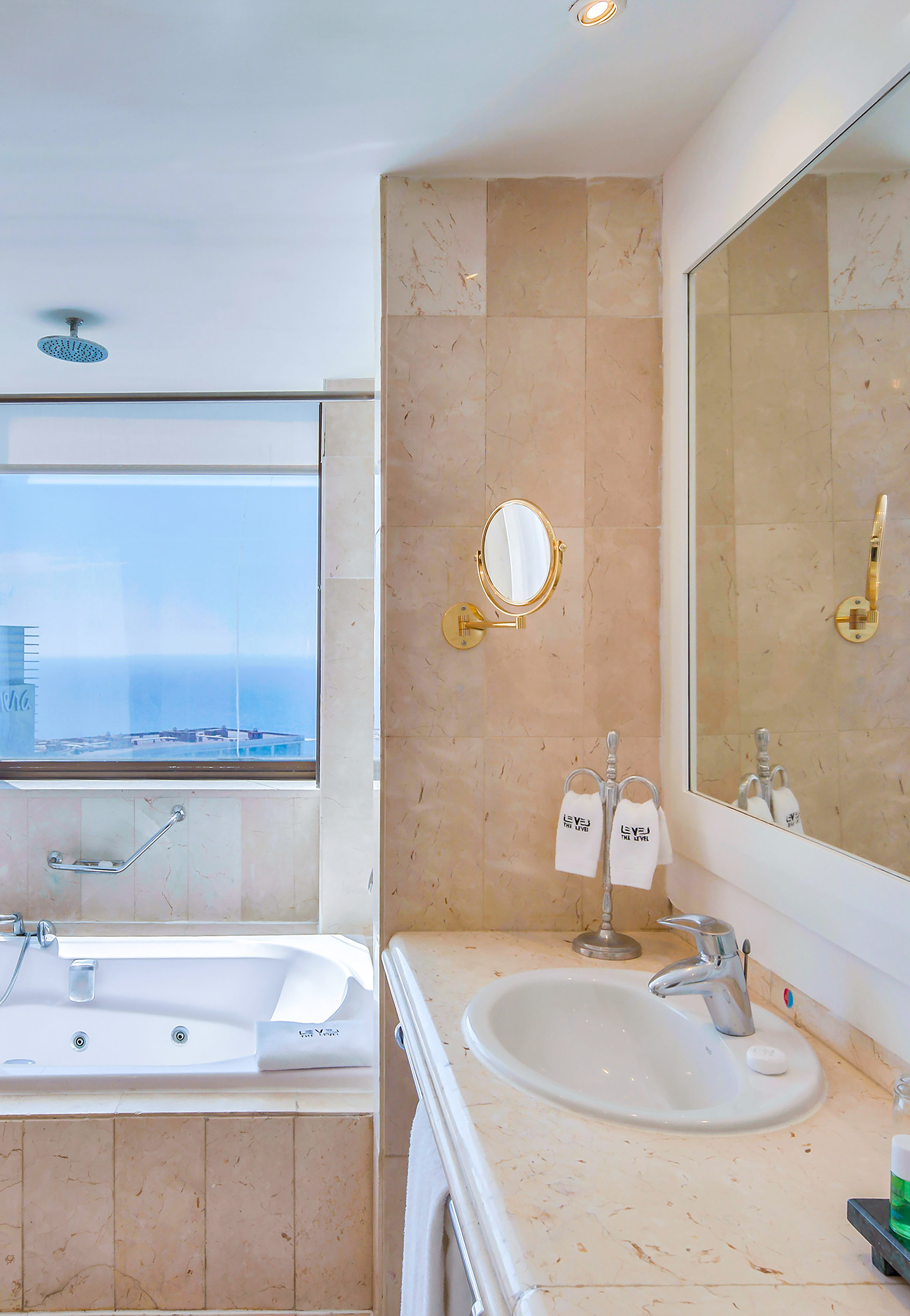 a bathroom with a tub and sink