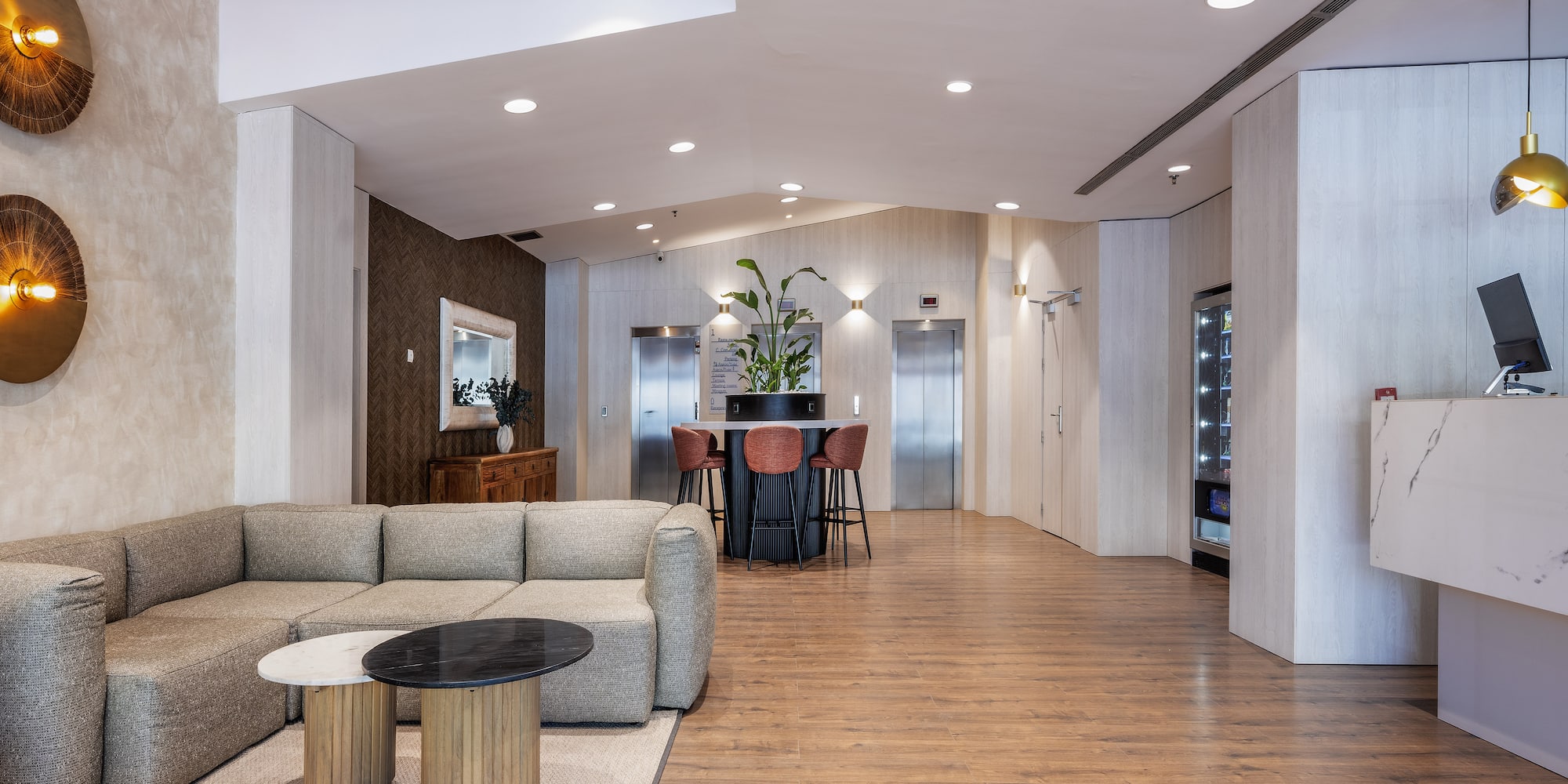 a room with a couch and chairs