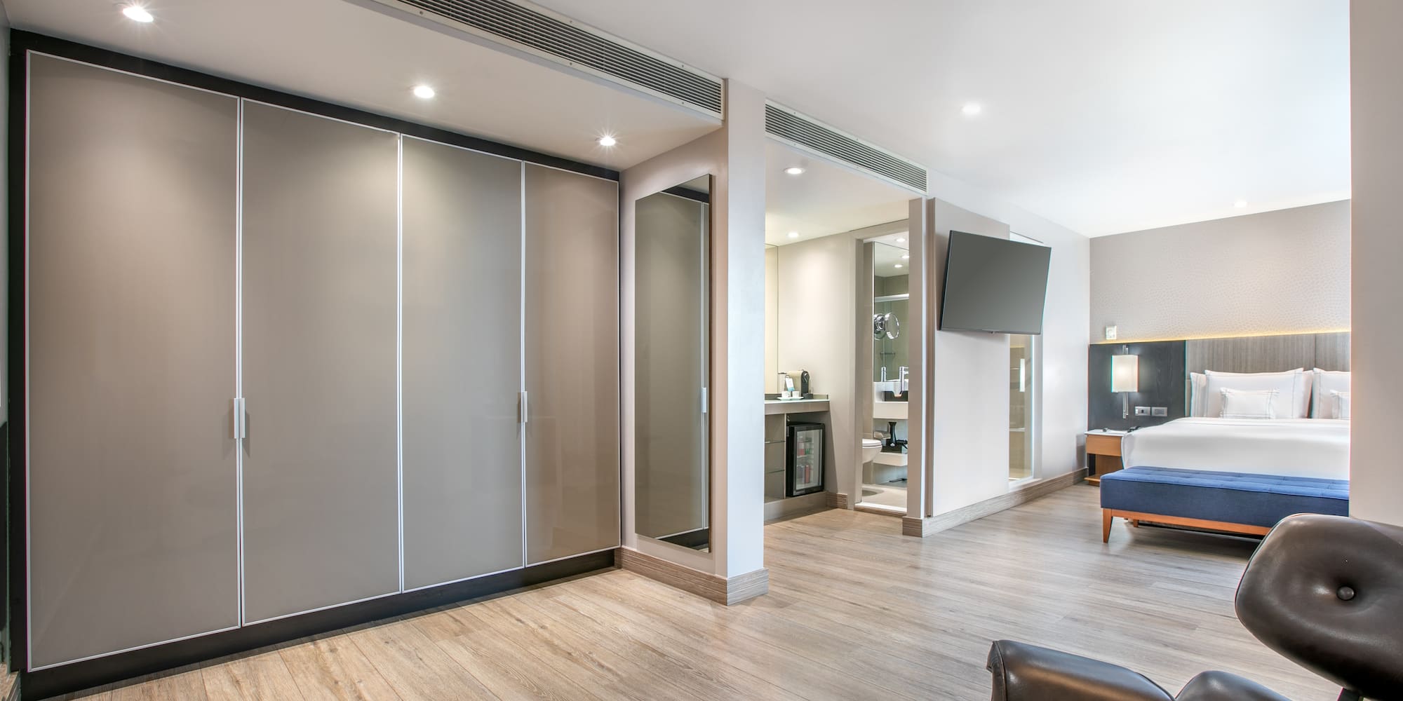 a room with a bed and a large closet