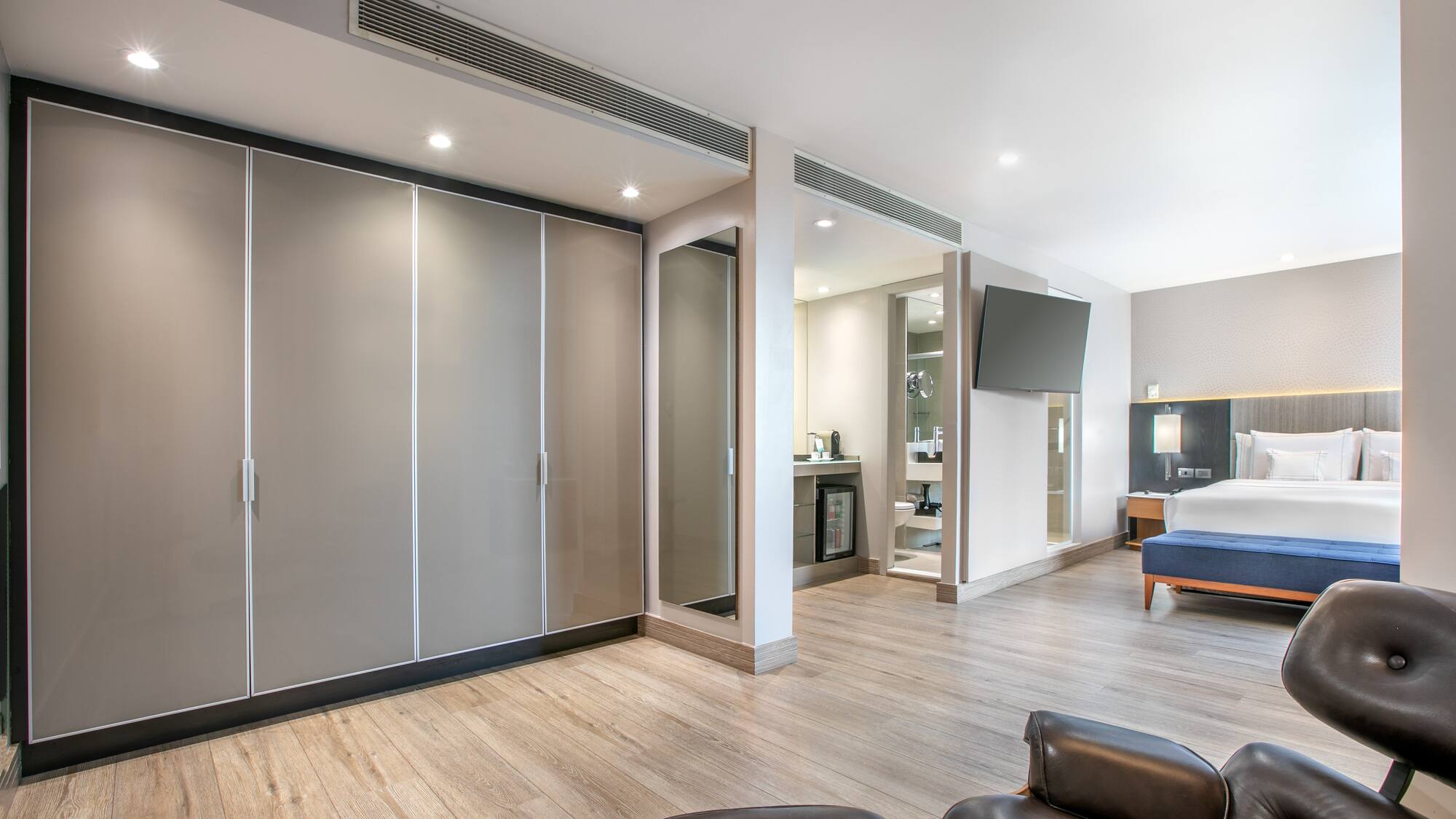 a room with a bed and a large closet