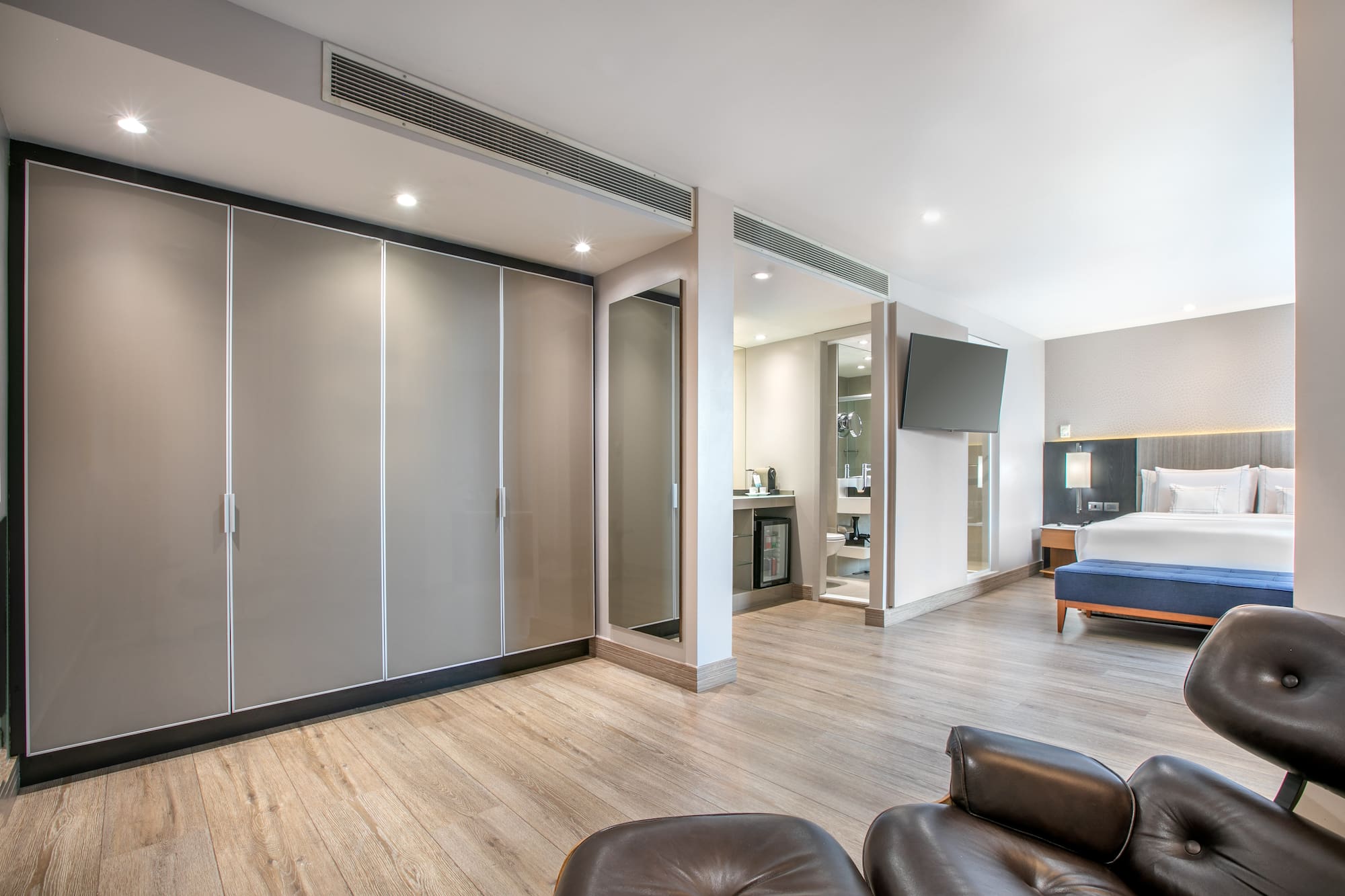 a room with a bed and a large closet