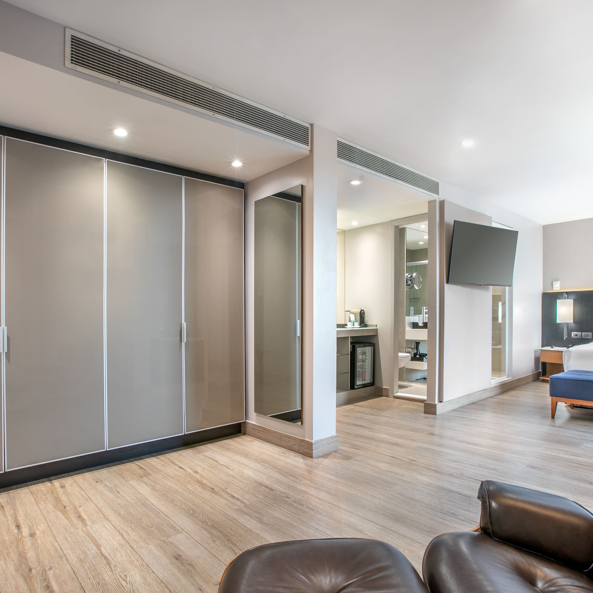 a room with a bed and a large closet