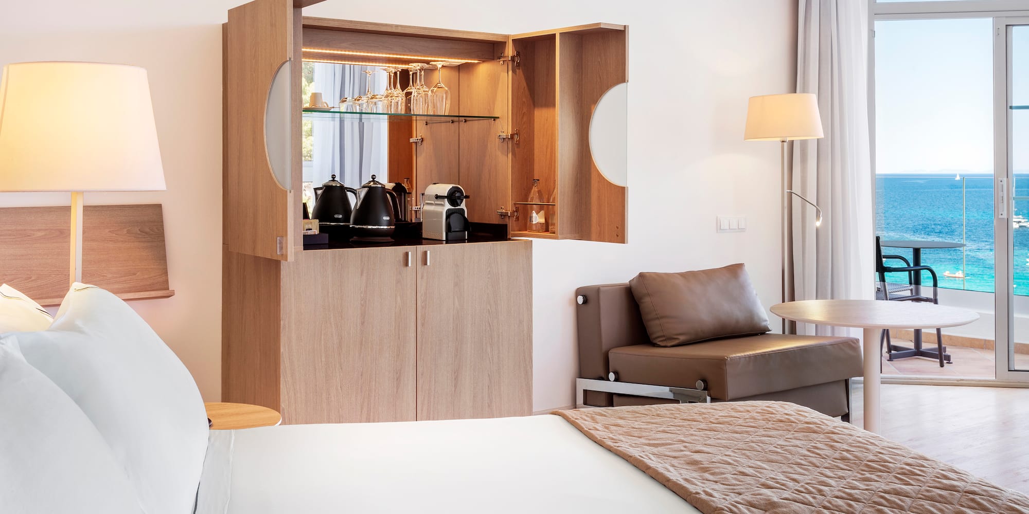 a room with a bed and a coffee maker