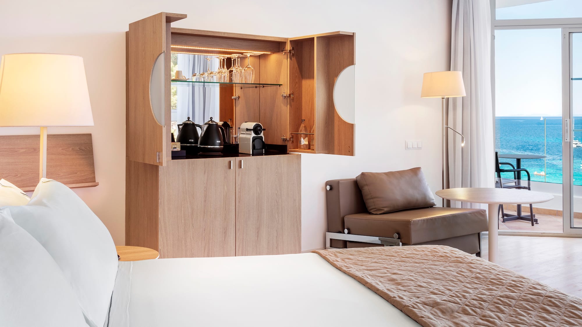 a room with a bed and a coffee maker