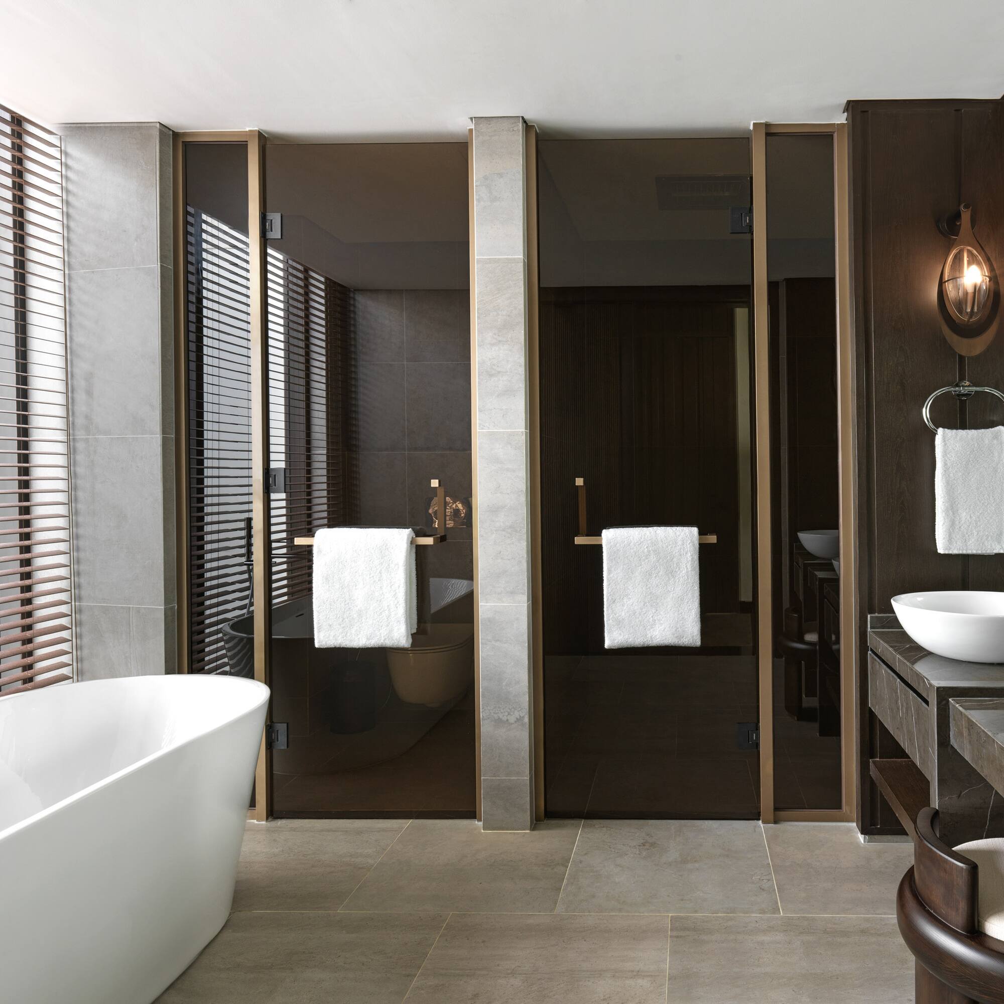 a bathroom with a tub and sink