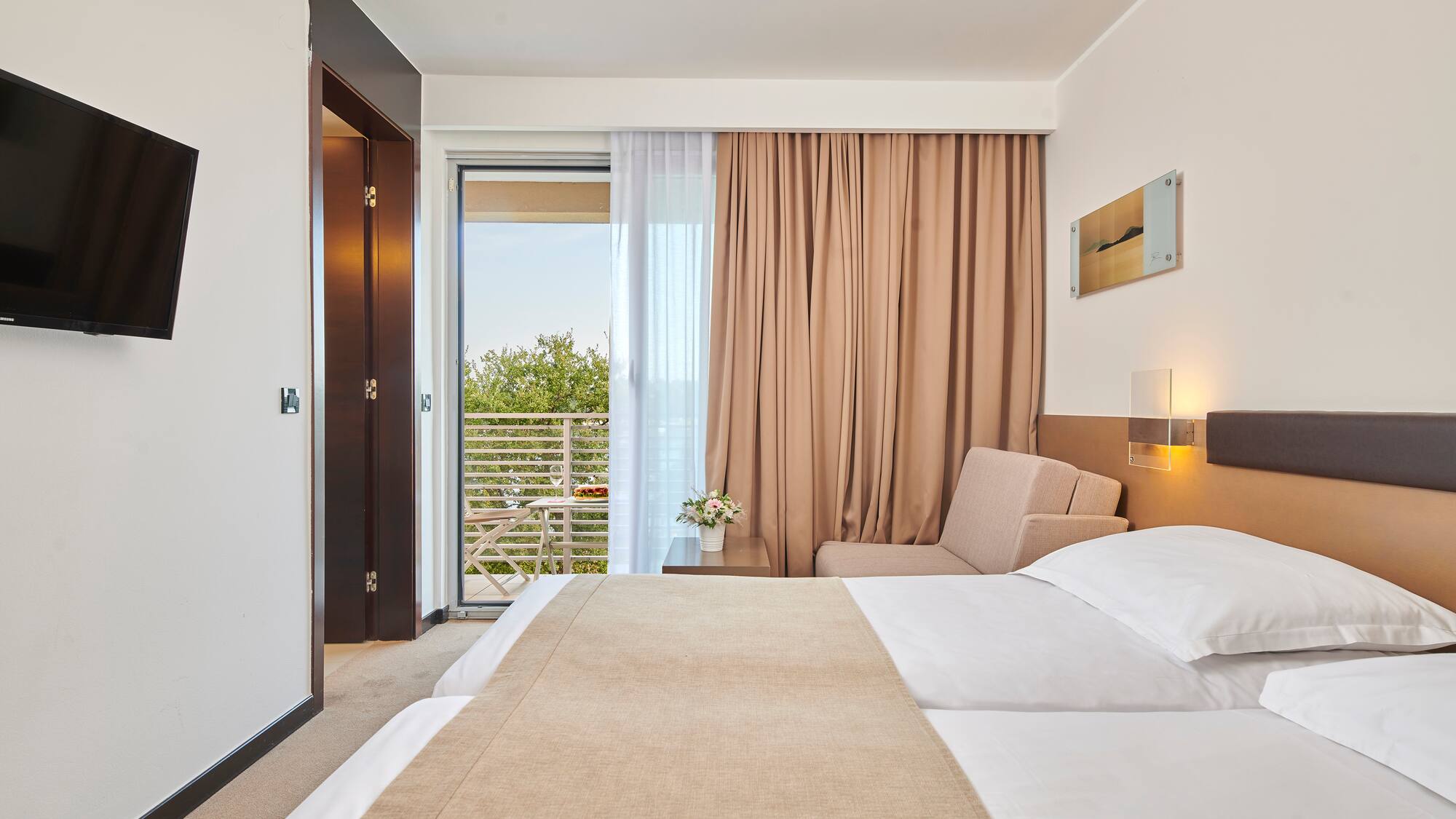 a bedroom with a bed and a door