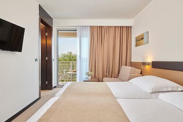 a bedroom with a bed and a door