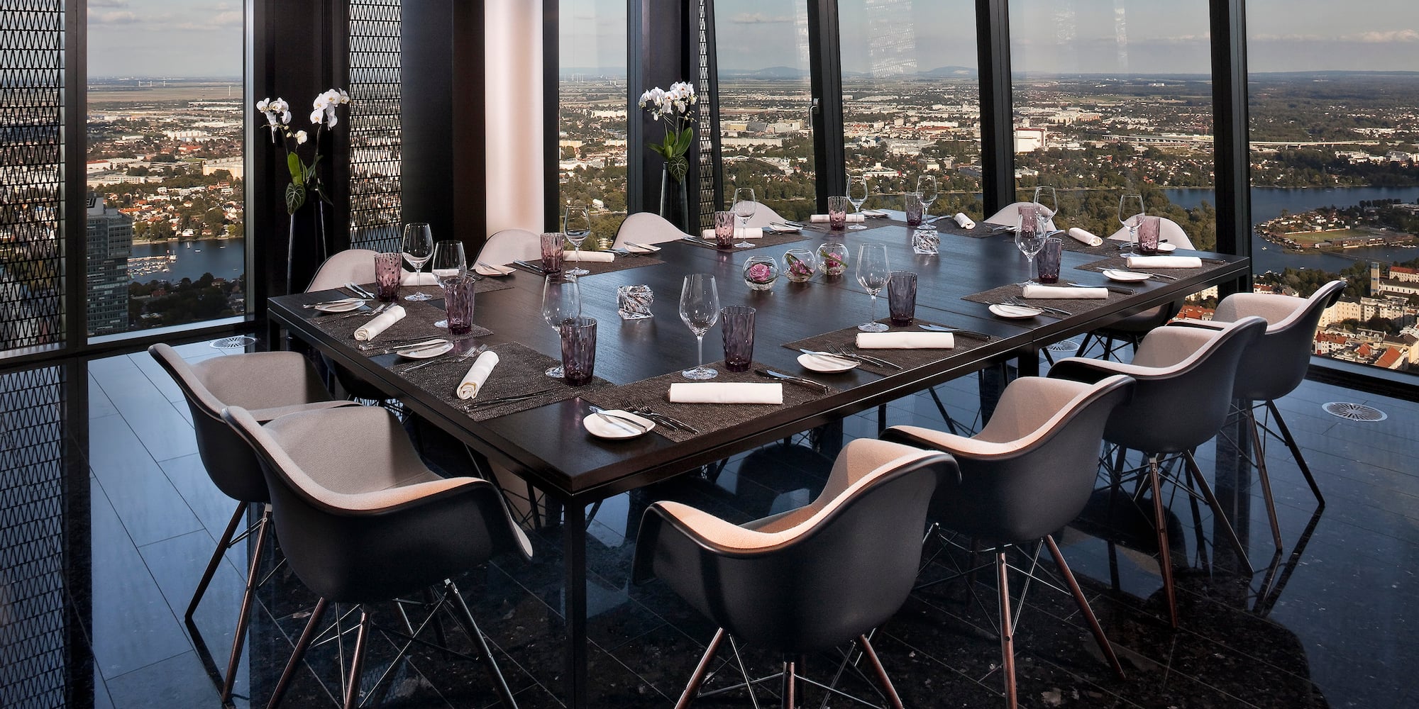 a table with chairs and glasses on it
