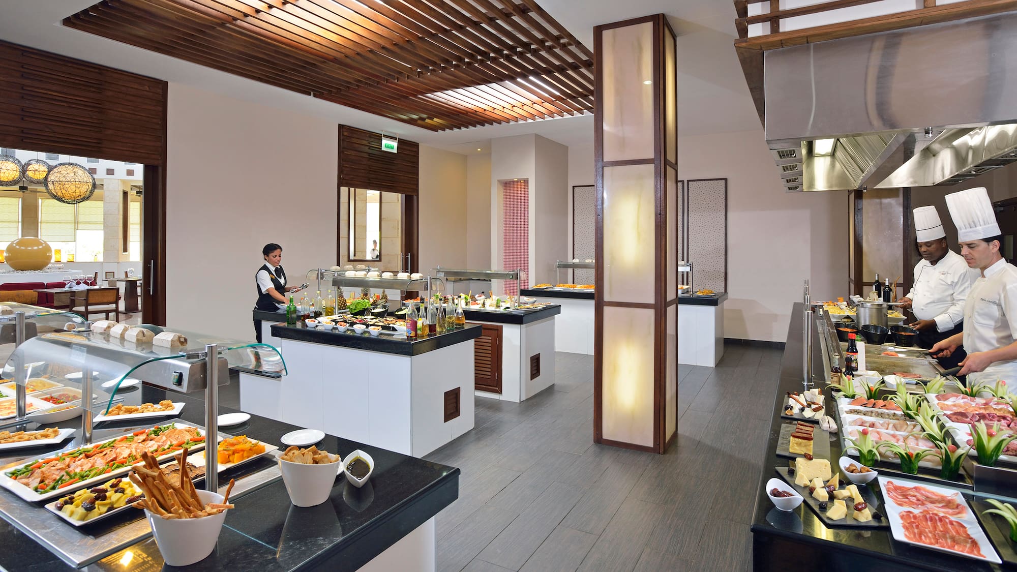 a buffet room with a person behind it