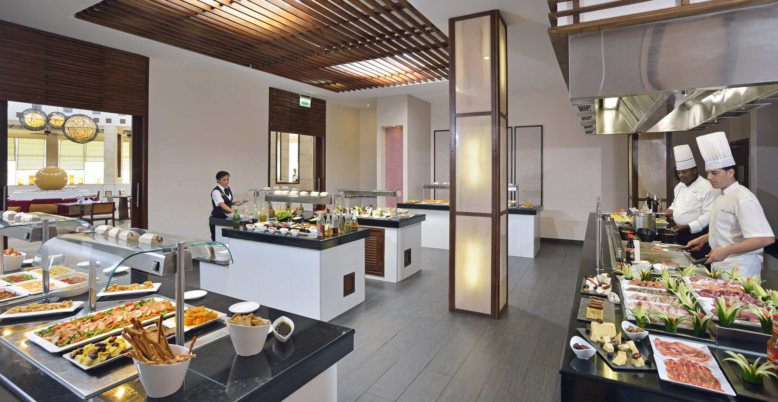 a buffet room with a person behind it