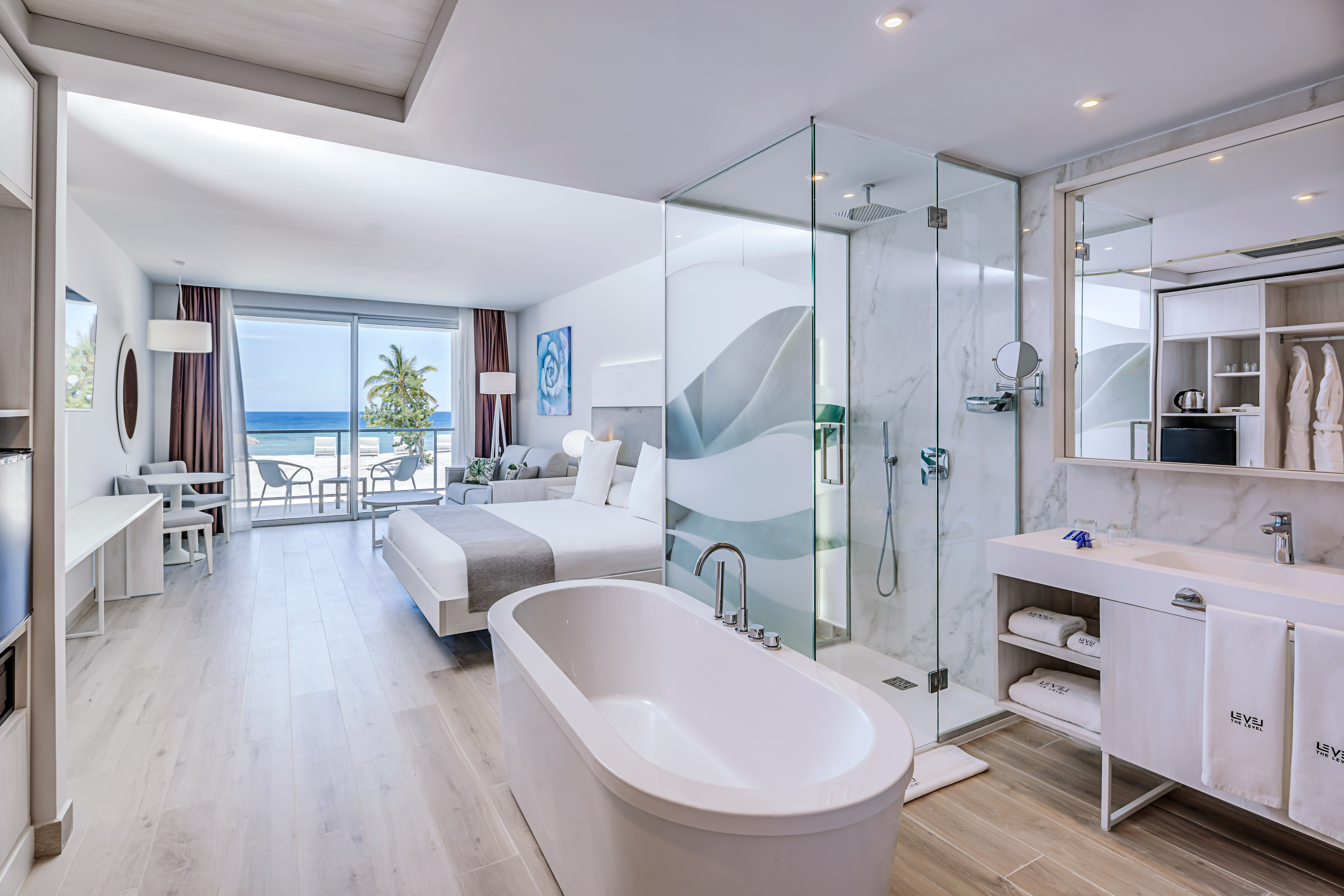 a bathroom with a glass shower and a bathtub