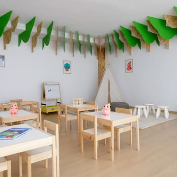 a room with tables and chairs