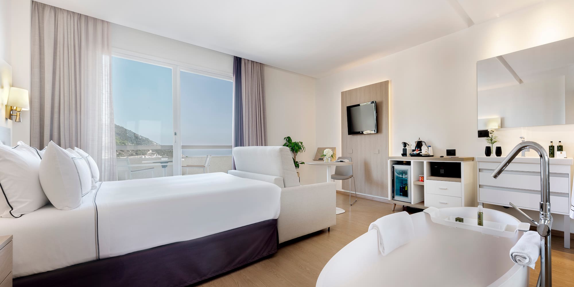 a room with a bed and a tub