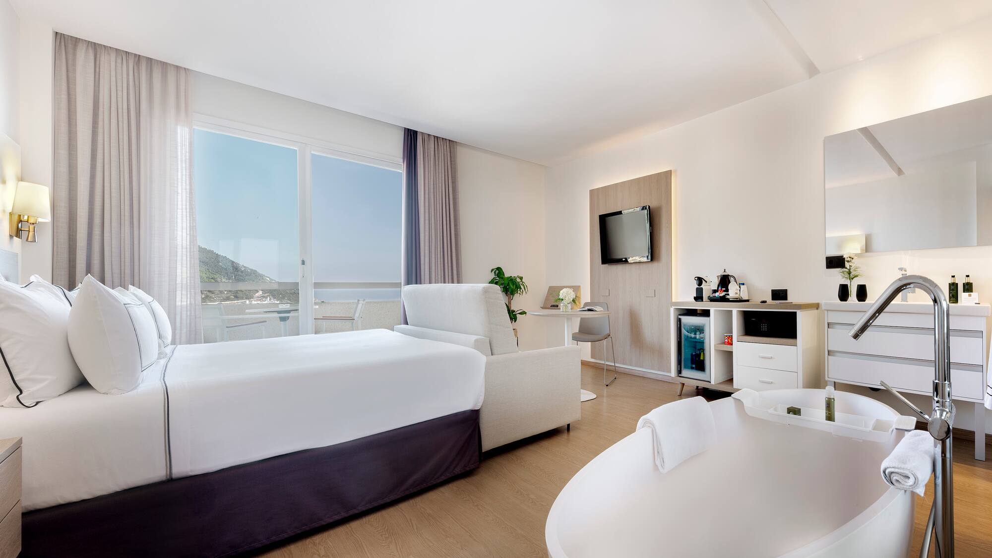 a room with a bed and a tub