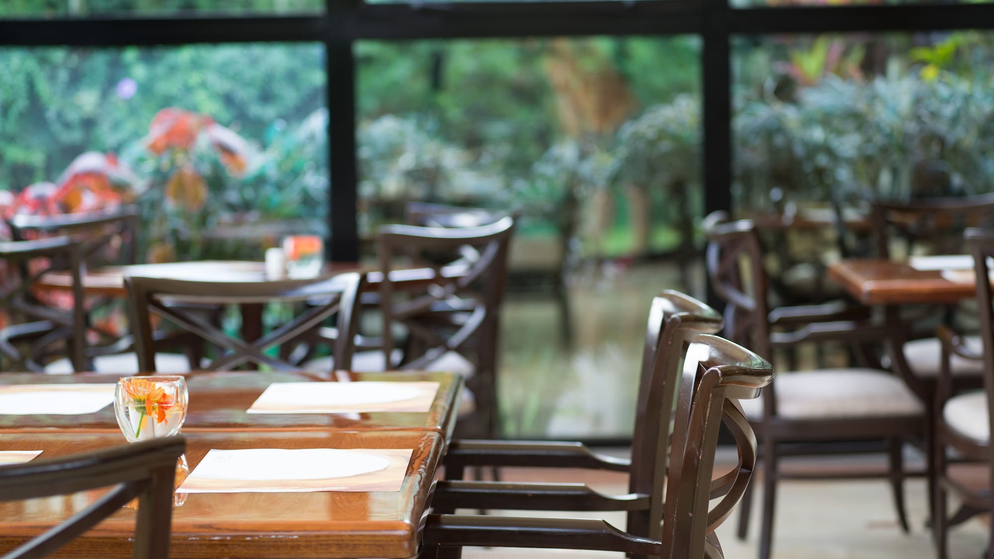 a restaurant with tables and chairs
