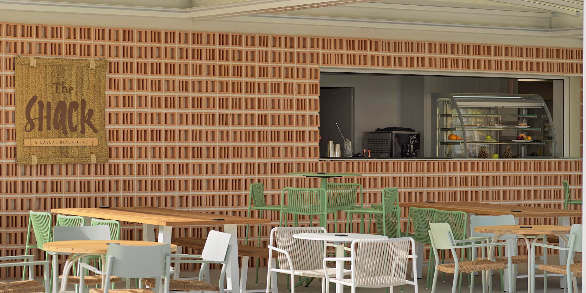 a patio with tables and chairs