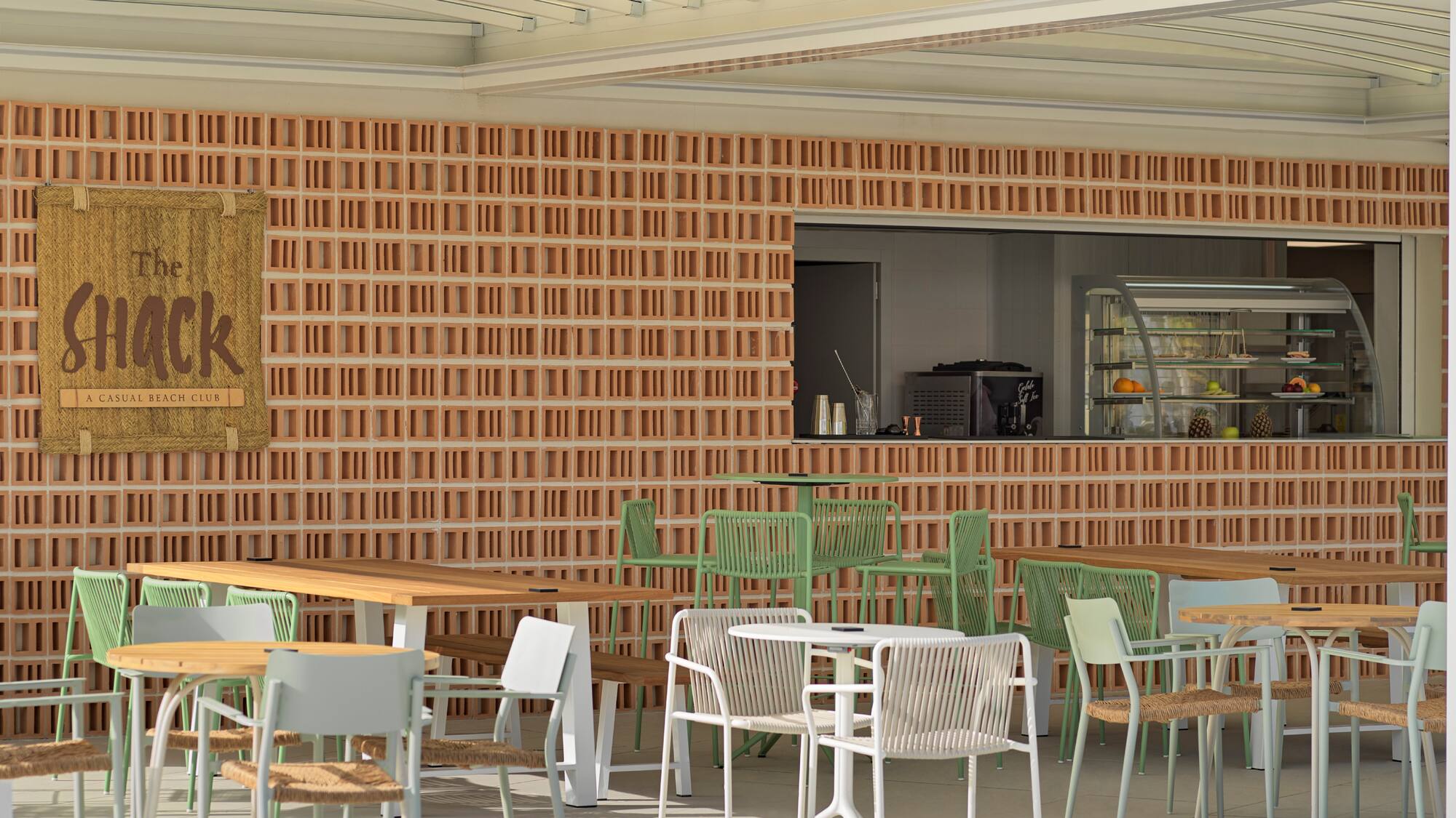 a patio with tables and chairs