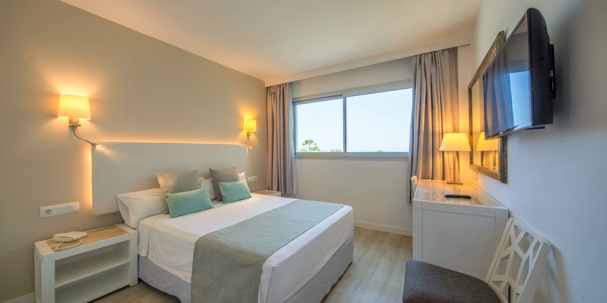 a bedroom with a bed and a table