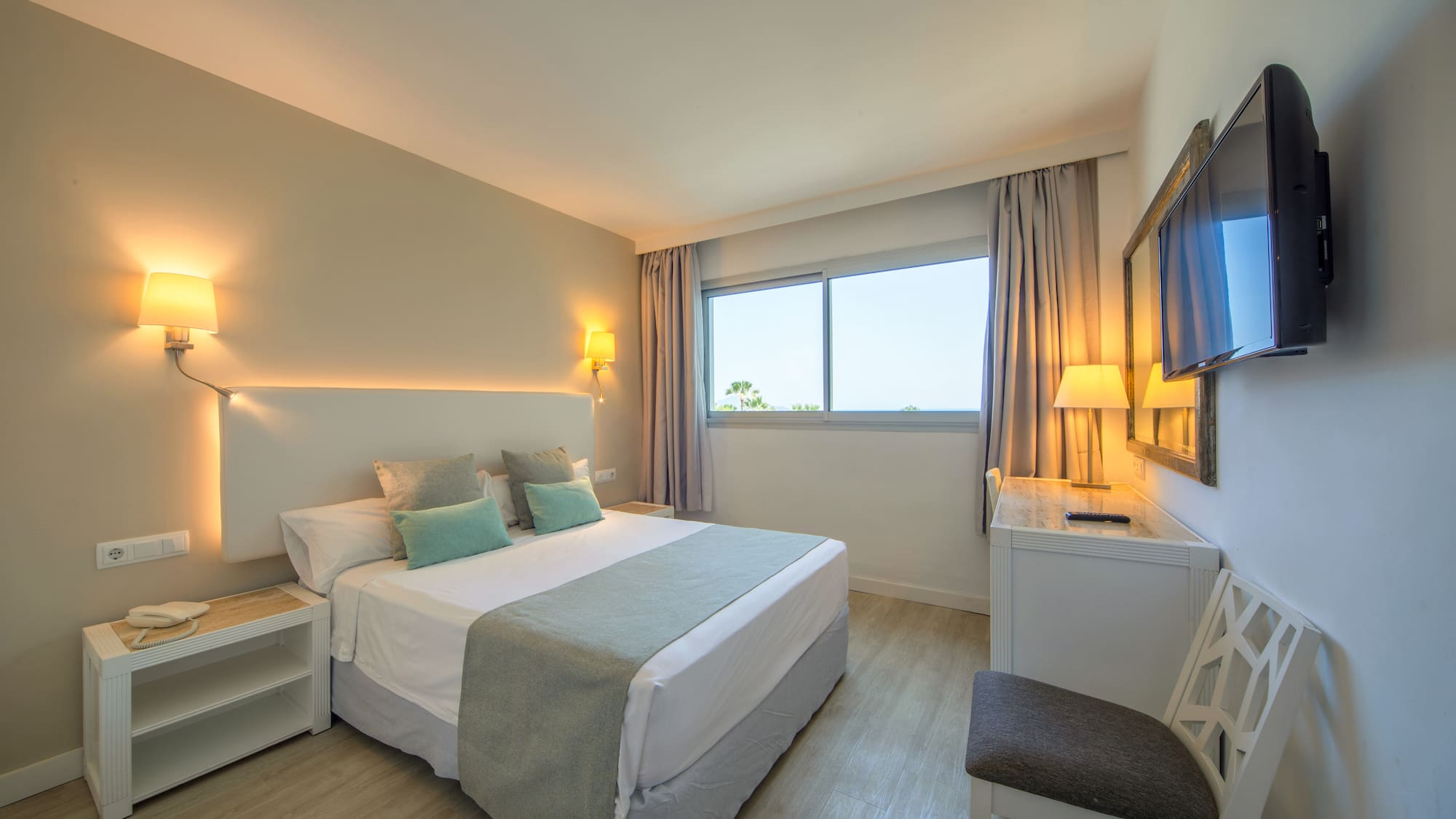 a bedroom with a bed and a table